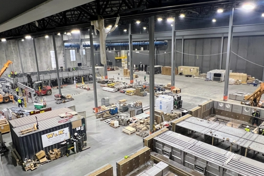 interior of industrial building warehouse with shelving, equipment and product